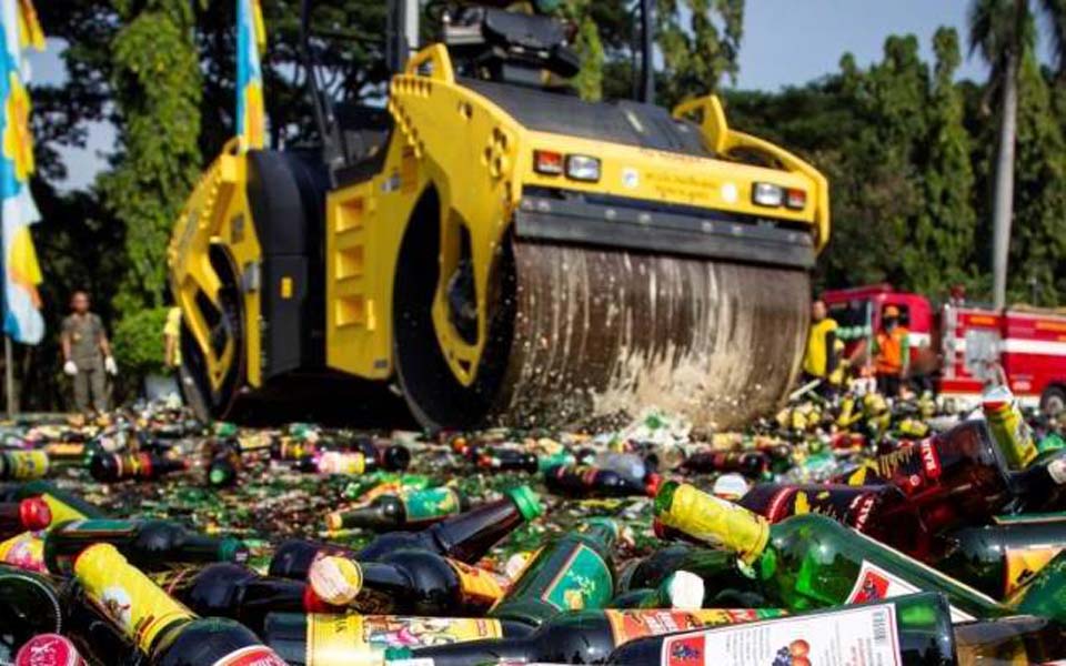 Illegal alcohol being bulldozed at National Monument in Jakarta – May 27, 2019 (Antara)