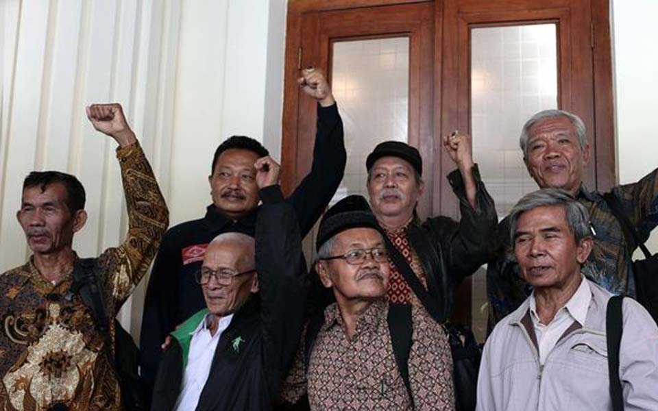 YPKP 65 and 1965 survivors at security ministry office in Jakarta (CNN)