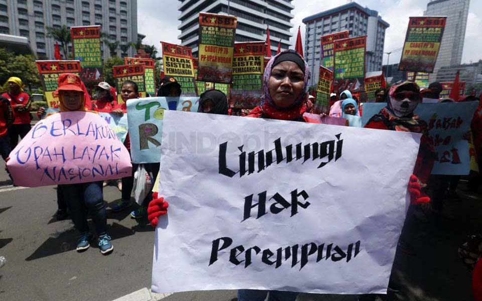 Women workers protest on International Women's Day in Jakarta (Sindo News)