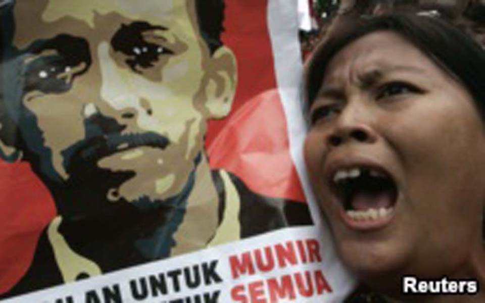 Protester shouts during protest outside BIN headquarters (Reuters)