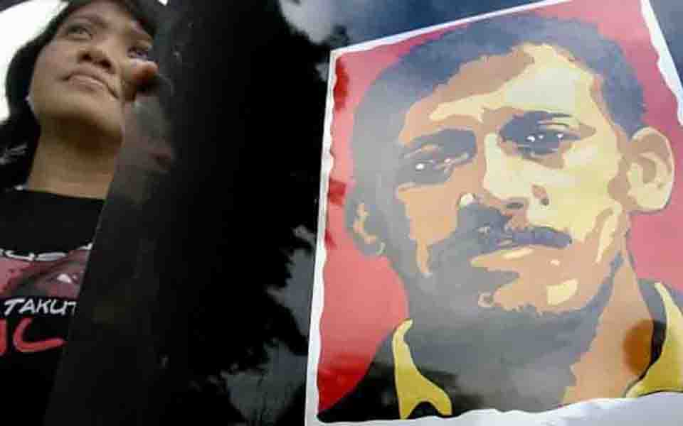 Protest calling for arrest of Munir's killer (AFP)
