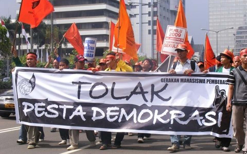 Banner reads 'Reject the Festival of Democracy'