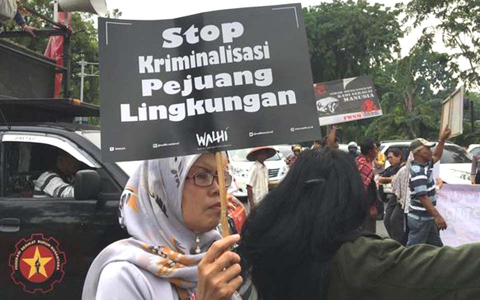 Walhi activists protest at State Palace in Jakarta – December 11, 2018 (CNN)