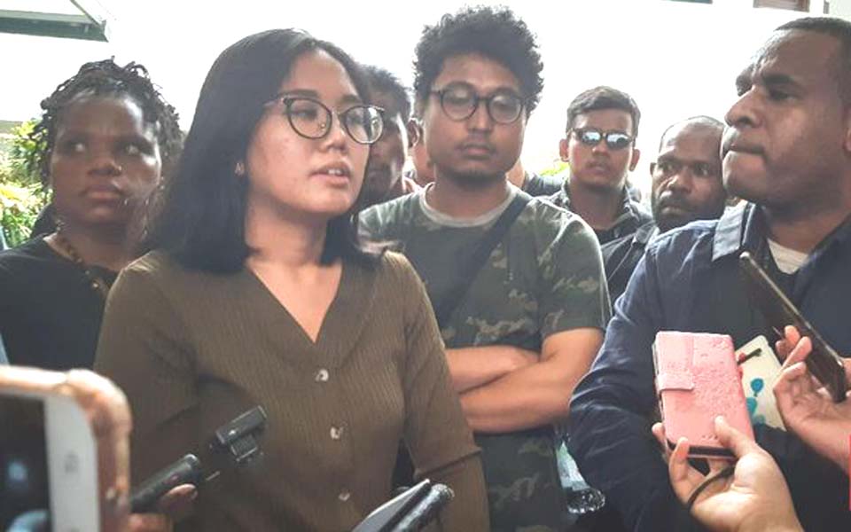 Papua Advocacy Team lawyer Okky Wiratama (second left) speaks to reporters (CNN)