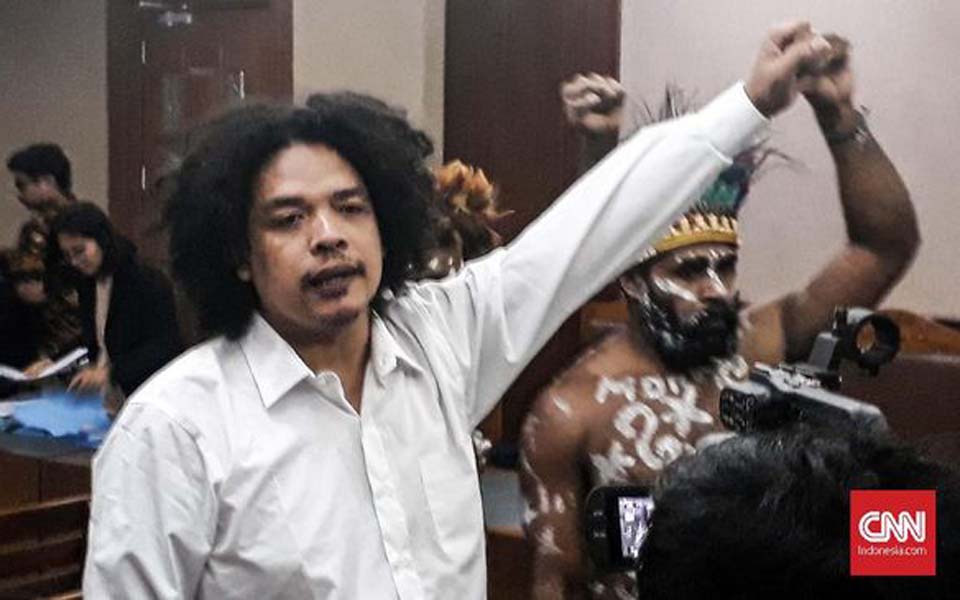 Surya Anta raises his fist during first treason trial hearing in Jakarta – December 16, 2019 (CNN)