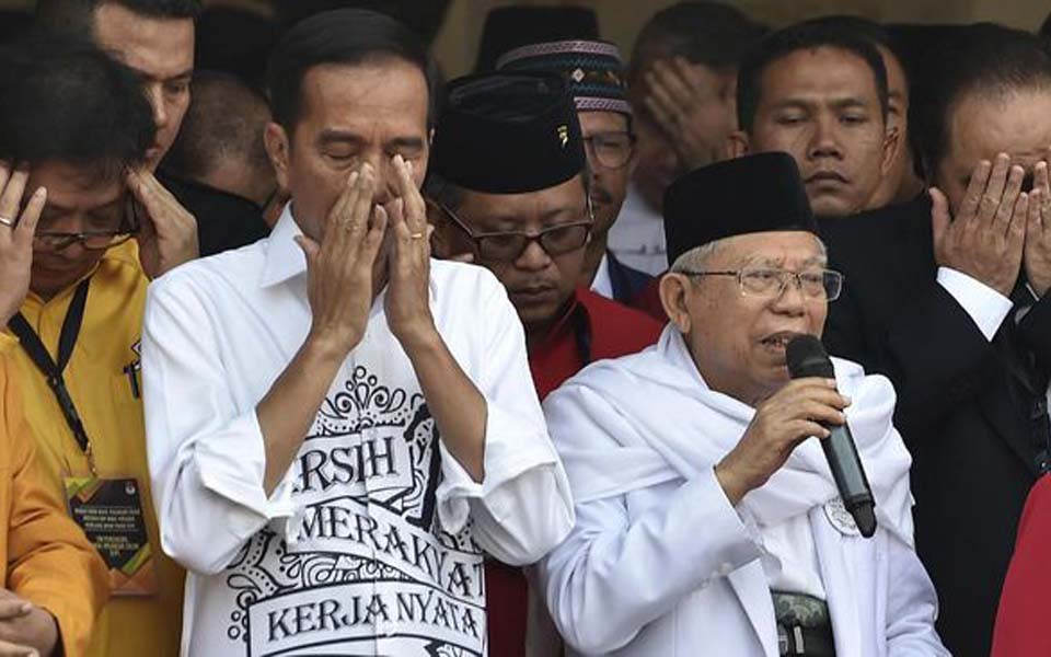 Widodo and vice presidential running mate Ma’ruf Amin (Antara)